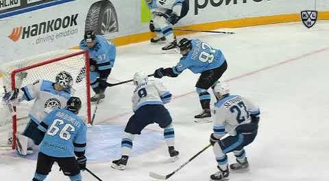 Buinitsky scores from behind the net